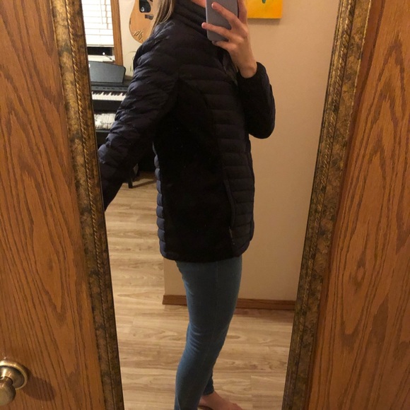Navy blue puffy jacket with black details. - Picture 2 of 3
